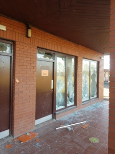 vandalised entrance to a sports and social club