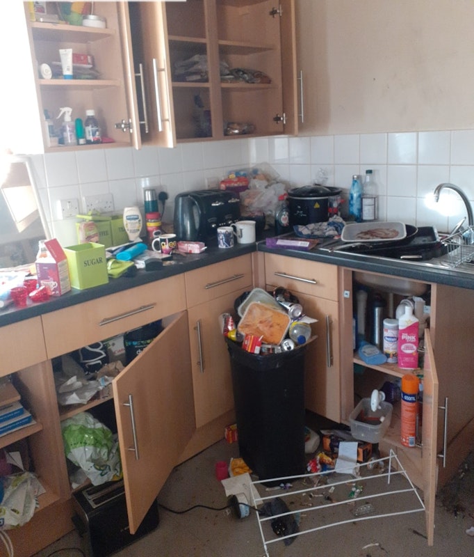 untidy kitchen after squatters