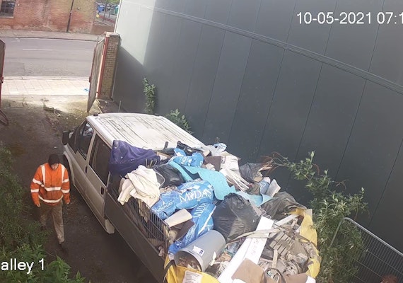 camera caption of piles of rubbish